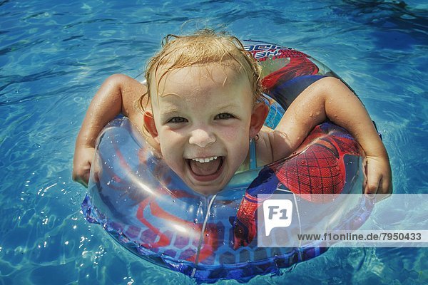 Young girl swimming in pool