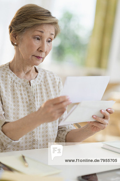 Senior woman reading letter
