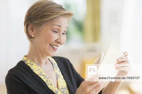 Senior woman reading note