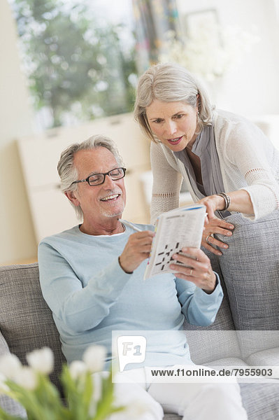 Senior couple doing crossword