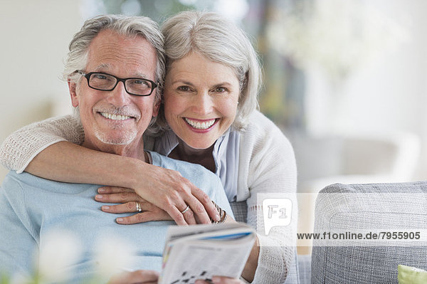 Senior woman embracing senior man