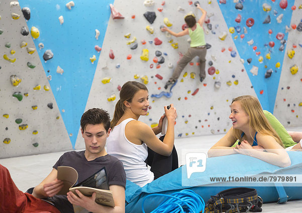 Friends relaxing together  indoor climbing