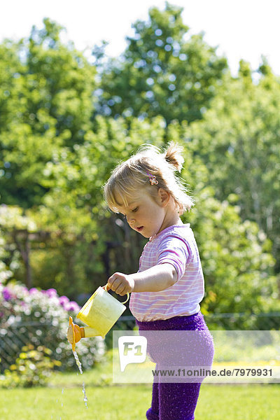 Girl watering plants