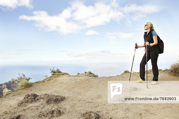 USA  Hawaii  Mid adult woman standing on top of mountain