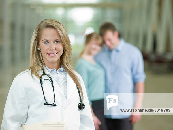 Young doctor with stethoscope smiling  portrait