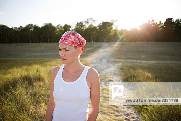 Young Woman against Sunset Light.