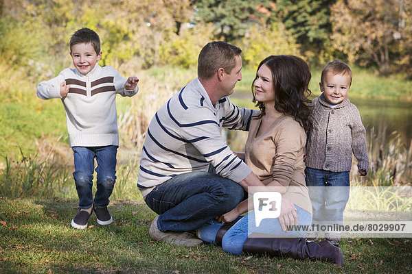 A family spending quality time together in the park in autumn St. albert alberta canada