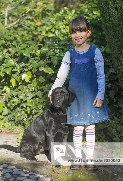Young girl with her pet labrador Malaga andalusia spain