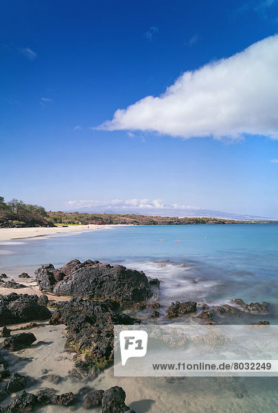 Hawaii  Big Island  Hapuna Beach Park  Rocky shore and clear blue water.