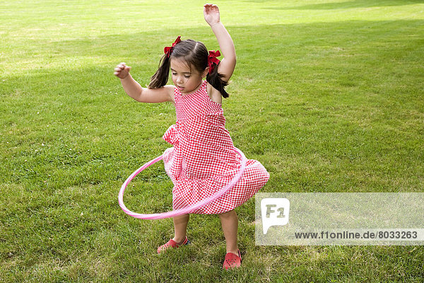 Young Asian-Caucasian Girl Playing With Her Hula Hoop  Ontario Canada