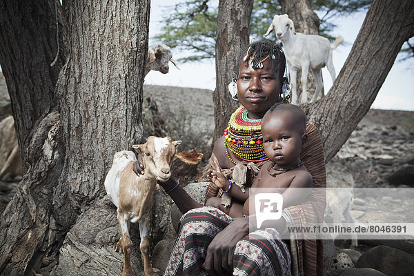 Portrait of traditionally dressed Turkana woman and child  Loyangalani  Kenya