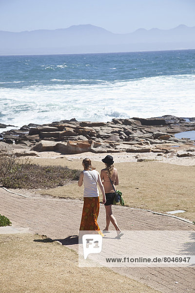 South Africa  Girls walking on path  Mossel Bay