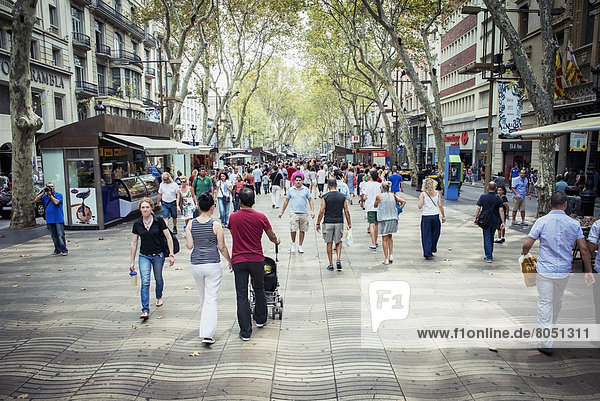 People walking on promenade  Barcelona  Spain