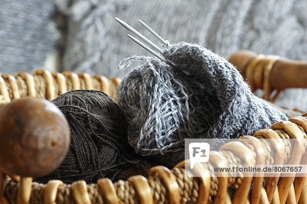 Knitting paraphernalia in a basket