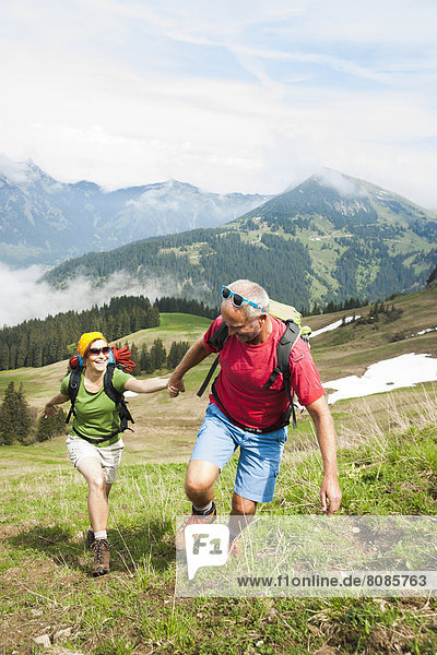 Couple hiking  Neunerkoepfle  Allgaeu Alps  Tannheim Valley  Tyrol  Austria  Europe