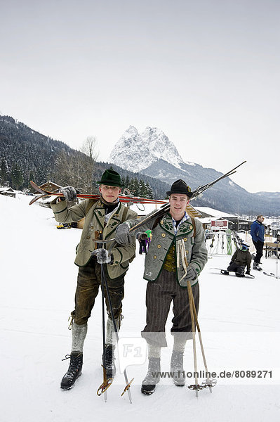 Skiers with equipment from the 1930s  Mt Alpspitze at back