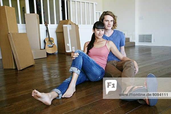 Couple relaxing in new home