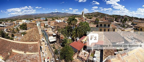 Panoramic view over the pantiled rooftops and cobbled streets of the town towards the belltower of The Convento de San Francisco de Asis  Trinidad  UNESCO World Heritage Site  Cuba  West Indies  Central America
