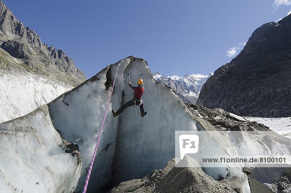 Ice climber at Mer de Glace glacier  Chamonix  Haute-Savoie  French Alps  France  Europe