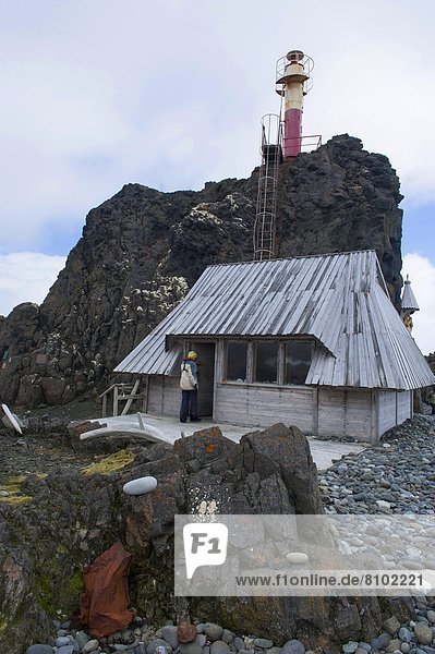 Little chapel and lighthouse at the Henryk Arctowski Polish Antarctic Station  King George Island  South Shetland Islands  Antarctica  Polar Regions
