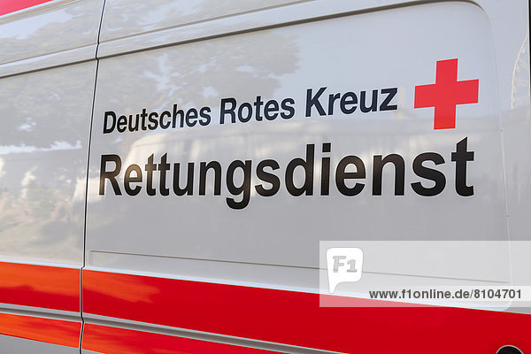 'Lettering ''Deutsches Rotes Kreuz  Rettungsdienst''  German for '' ''German Red Cross  Emergency Services'' on an ambulance'