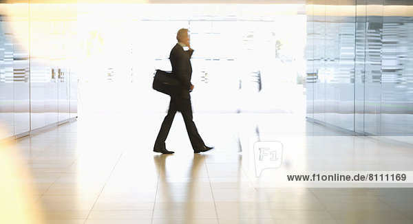 Businessman walking in lobby