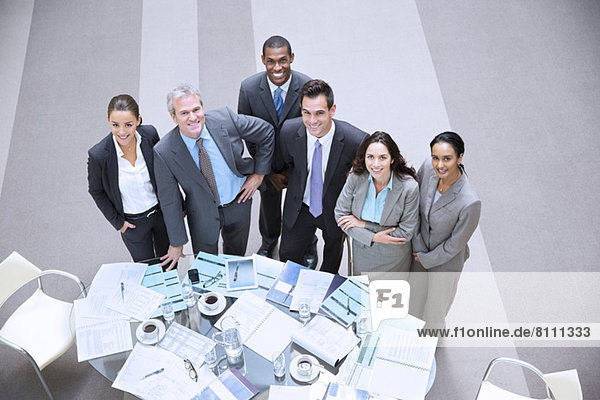 High angle portrait of smiling business people at table