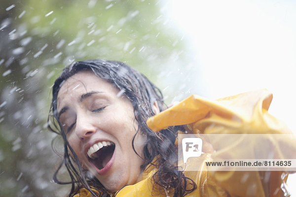 Rain falling on surprised woman