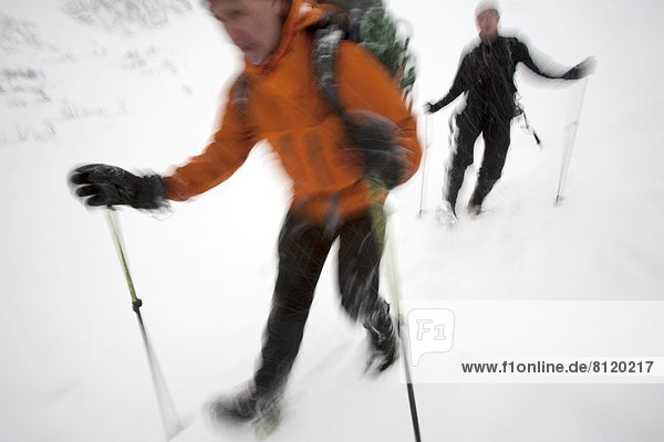 35-39 Years 55-59 Years Adult Adventure Blurred Motion Challenge Cold Temperature Color Image Day Endurance Exploration Extreme Sports Extreme Terrain Full Length Horizontal Leisure Activity Men Mid Adult Mount Washington Mountain Climbing Nature New Hampshire Outdoors Photography Presidential Range Recreational Pursuit Selective Focus Snow Sport Tuckerman's Ravine Two People USA