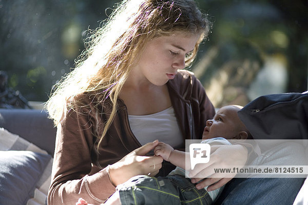Europe Netherlands 14-15 Years 6-7 Months Affectionate Baby Girls Indoors Kissing innocense Teenage Girl Two People Bonding Care Love Togetherness Close-up Color Image Photography Holland