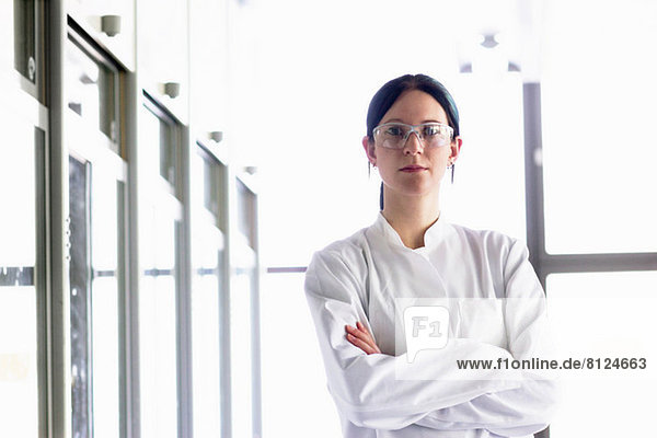 Portrait of female scientist wearing protective goggles