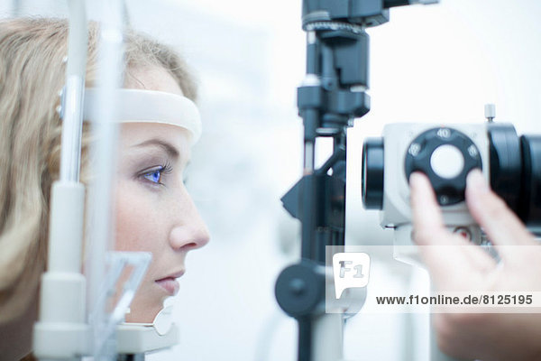 Female having her eyes examined