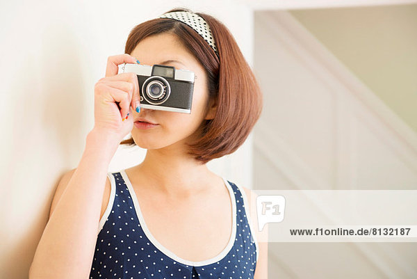 Woman taking photograph