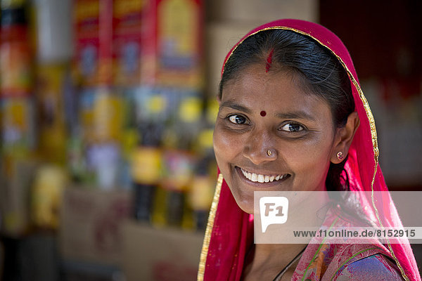 Smiling Indian woman wearing a dupatta scarf with a bindi  portrait