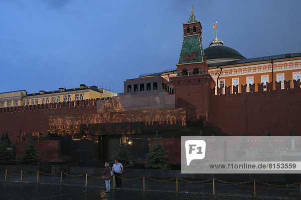 Kremlin and Lenin Mausoleum  reflection of the GUM department store in the marble wall of the Mausoleum  Red Square  Krasnaya Ploshchad  in the evening