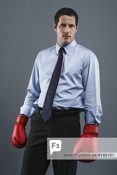 Portrait of mature man wearing boxing glove