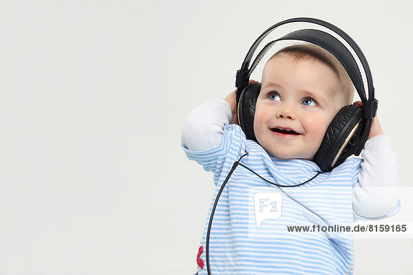 Baby boy with headphones  smiling