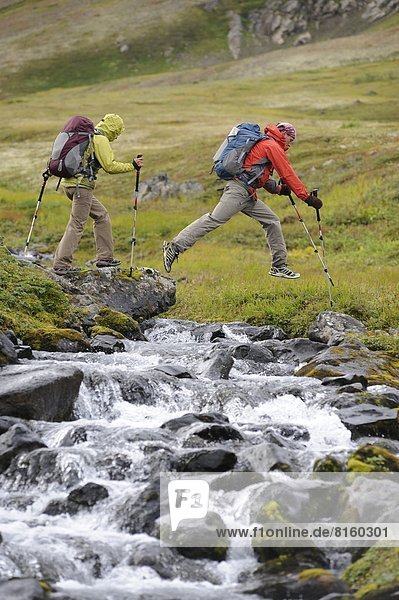 Backpackers hike in Chugach State Park near Anchorage  Alaska.