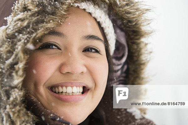 Portrait of smiling woman in warm clothing at winter