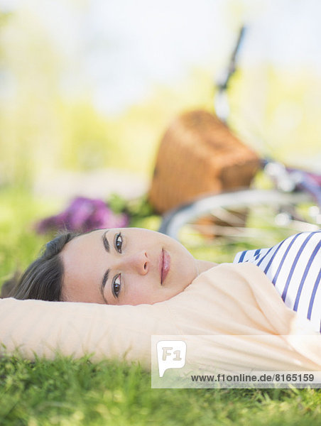 Portrait of mid adult woman relaxing in park