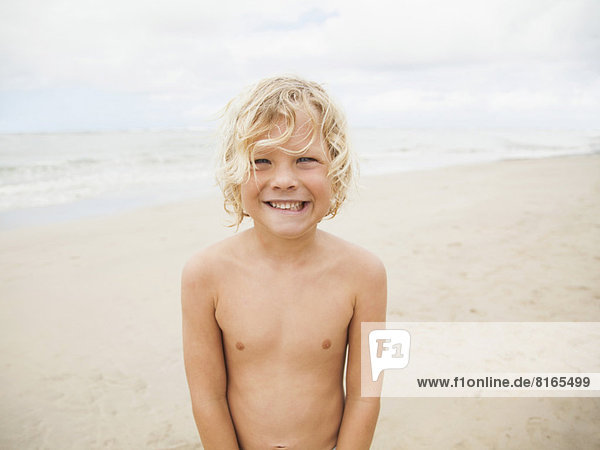 Portrait of boy (6-7) on beach