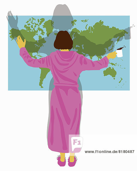 Woman in bathrobe with arms outstretched standing in front of world map
