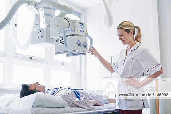 Radiologist scanning patient