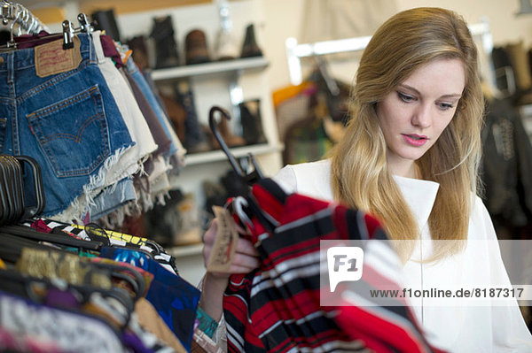 Woman looking at top garment