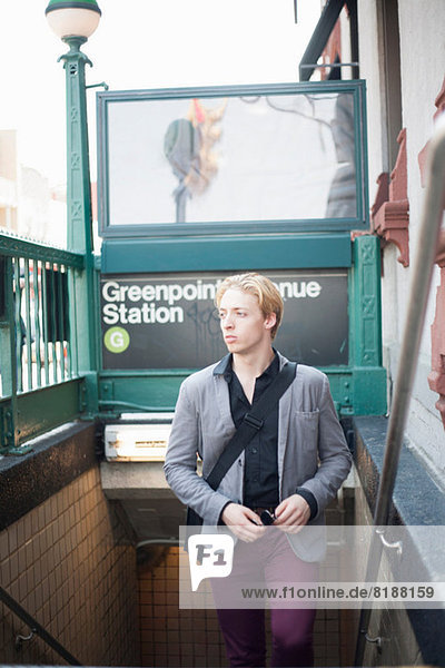 Young man emerging from subway station Brooklyn  New York City  USA