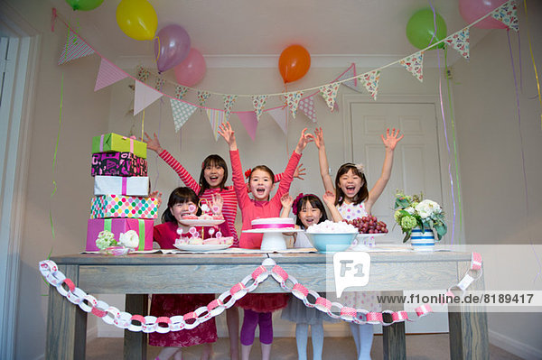 Girls cheering at birthday party