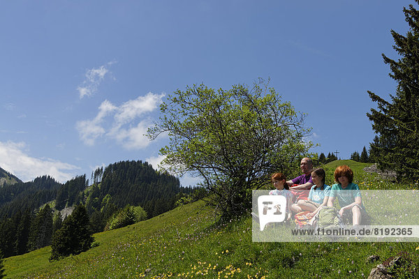 Hikers  father  45  daughters  11  son  13  resting on the Kappeler Alp