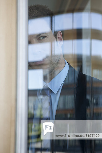 Businessman in office at the window