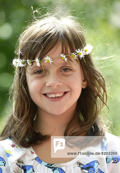 Smiling girl wearing a floral garland  portrait