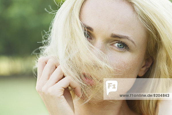 Woman covering face with hair  portrait
